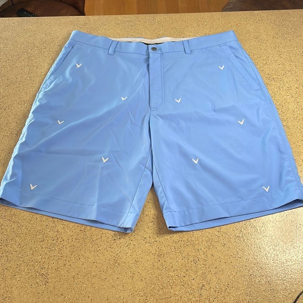 Mens Callaway light blue golf shorts with white embroidered logos throughout